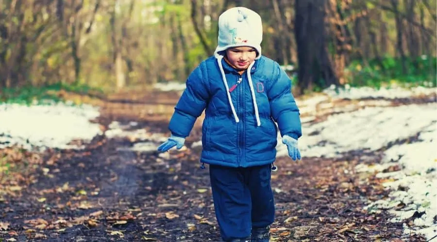 kid playing in snow intext