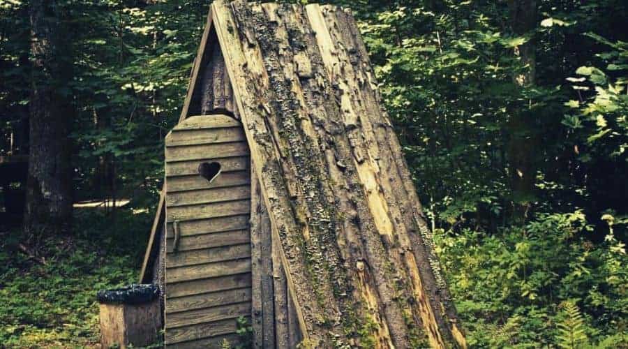 outhouse in forest intext