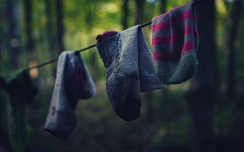 wool hiking socks hanging on line in forest