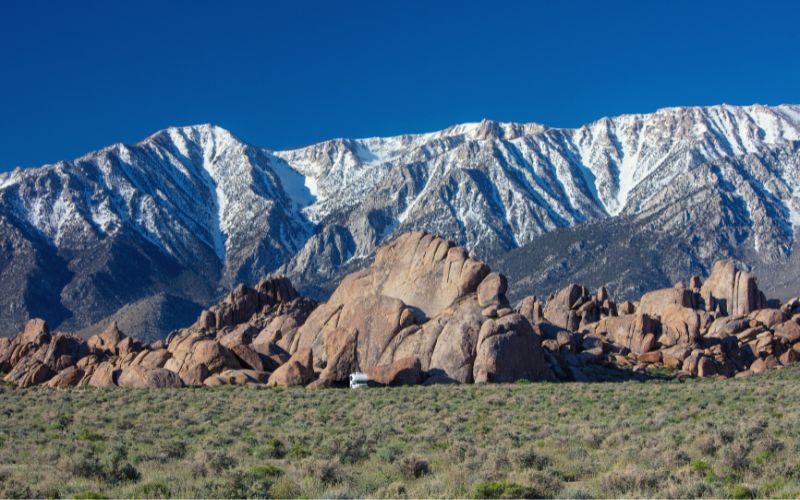 An RV parked at the base of the Alabama Hills in California